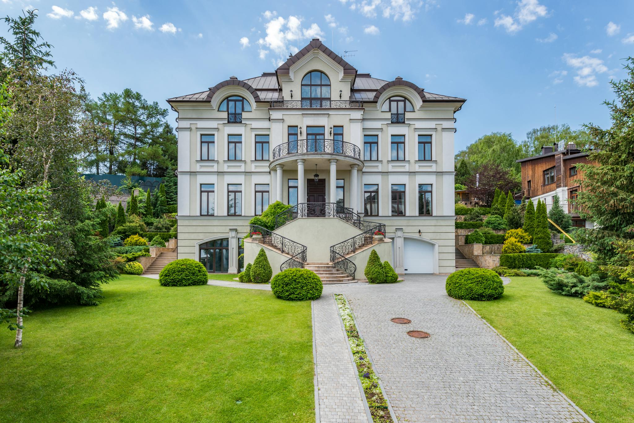 Exterior of classic residential house with green yard